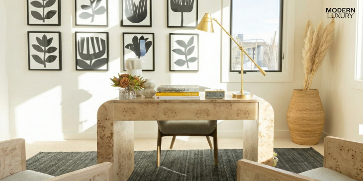 Brea desk in toasted burl with minimalist decor and framed botanical artwork in a bright office setting.